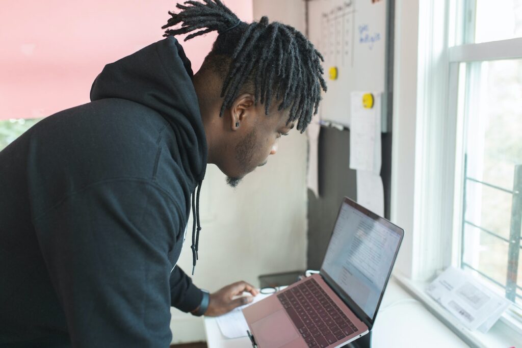 man looking at laptop